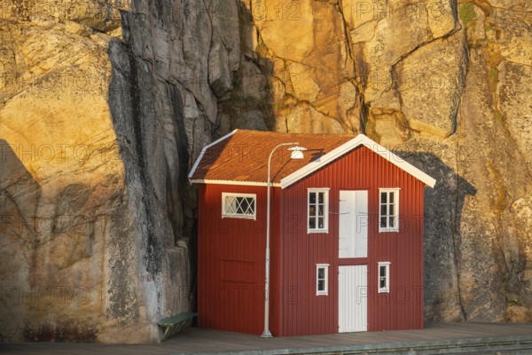 Boathouse between rocks in Smögen harbour, Smögenbryggan, Västra Götalands Län, Bohuslän, Sweden