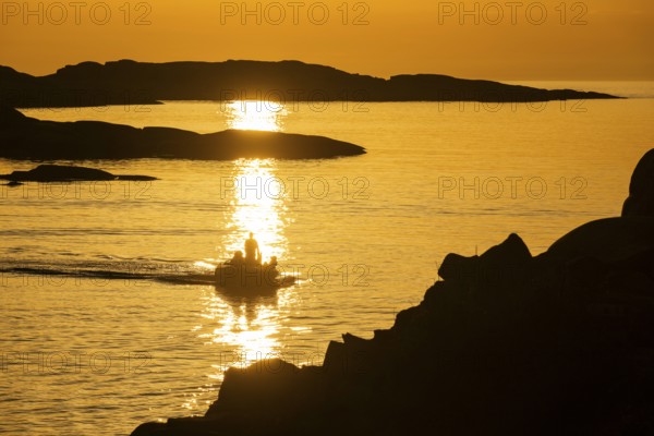 Motorboat between archipelago at sunset, archipelago landscape, Smögen, Smögenbryggan, Västra Götalands Län, Bohuslän, Sweden