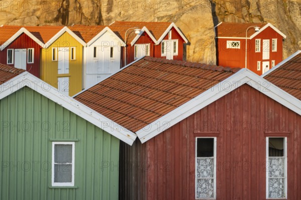 Colourful boathouses between rocks in the harbour of Smögen, Smögenbryggan, Västra Götalands Län, Bohuslän, Sweden