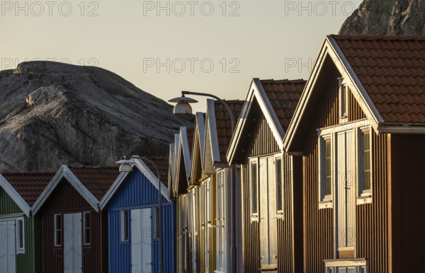 Boathouses between rocks in the harbour of Smögen, Smögenbryggan, Västra Götalands Län, Bohuslän, Sweden