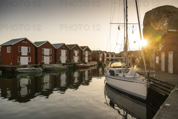 Boats and boathouses in the harbour of Smögen, Smögenbryggan, Västra Götalands Län, Bohuslän, Sweden
