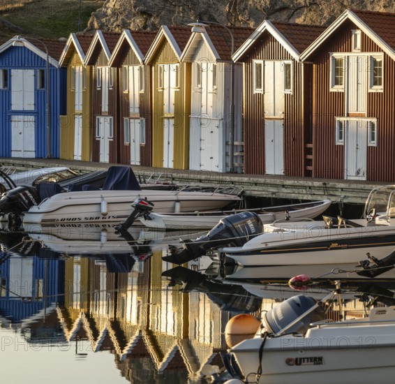 Boats and colourful boathouses in the harbour of Smögen, Smögenbryggan, Västra Götalands Län, Bohuslän, Sweden