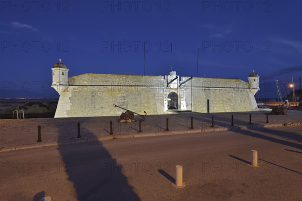 Forte da Ponta da Bandeira fortress by night, Lagos, Algarve, Portugal