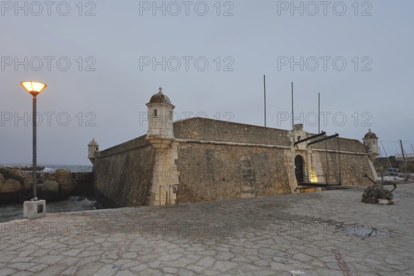 Forte da Ponta da Bandeira fortress at dusk, Lagos, Algarve, Portugal