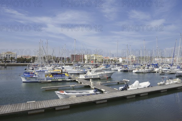 Pleasure boats and sailing boats in the marina, Lagos, Algarve, Portugal