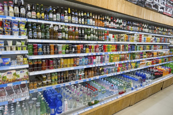 A supermarket shelf full of various drinks and refreshments, Gntunik supermarket, Aragazotn province, Armenia