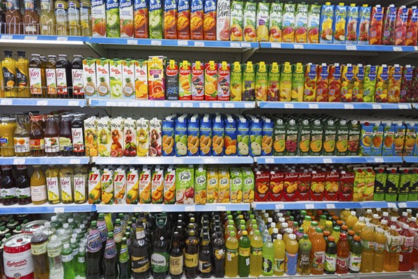 A shelf full of bottles of juices and other drinks in various flavours, Gntunik supermarket, Aragazotn province, Armenia