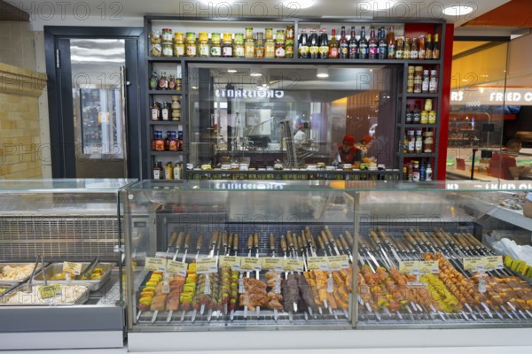 Barbecue skewers with meat and vegetables displayed in a market, Gntunik supermarket, Aragazotn province, Armenia