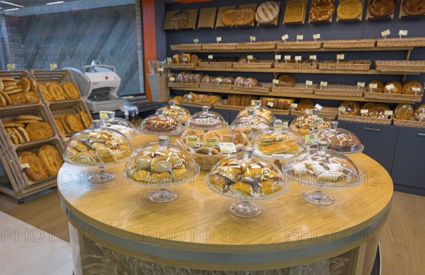 Various pastries and breads are decoratively displayed in a bakery, Gntunik supermarket, Aragazotn province, Armenia