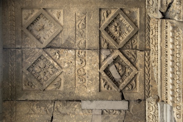 Fragment of the wall of an ancient temple with stucco, Geghard, Armenia