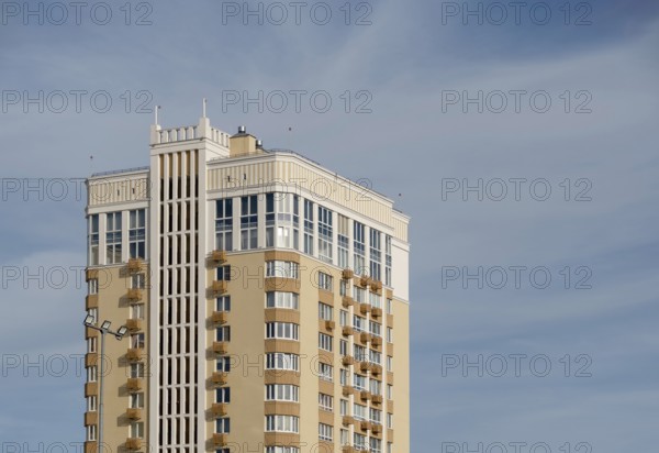Modern multi-storey building against sky, copy space