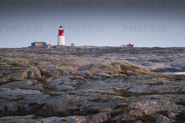 Lighthouse and houses in stony landscape, archipelago, Smögen, Smögenbryggan, Västra Götalands Län, Bohuslän, Sweden