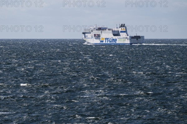 LNG-powered TT-Line ferry travelling across a gently moving blue sea, near Warnemünde, Rostock, Mecklenburg-Vorpommern, Germany