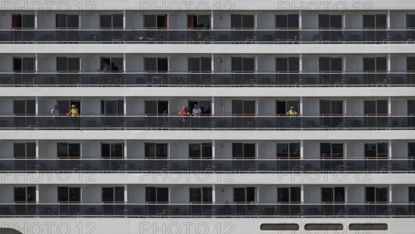 Detailed view of balconies of a cruise ship with passengers, Warnemünde, Rostock, Mecklenburg-Vorpommern, Germany