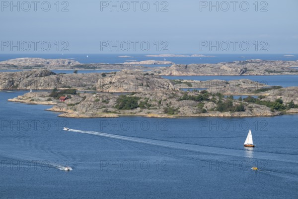 Rocky archipelago landscape with small house by the sea and boats, Fjällbacka, Bohuslän, West Sweden, Sweden