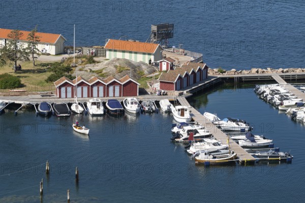 Small harbour with boats and boathouses, Fjällbacka, Bohuslän, West Sweden, Sweden