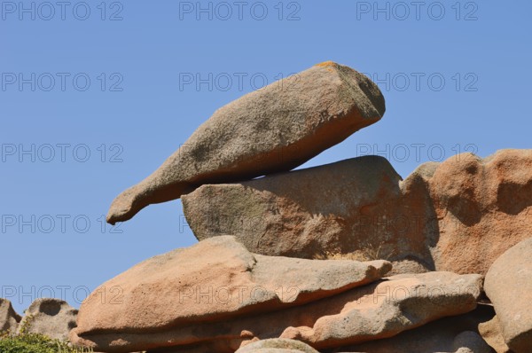 Granite rock in the shape of a bottle on the Cote de Granit Rose coast near Ploumanac'h, Cotes-d'Armor, Brittany, France