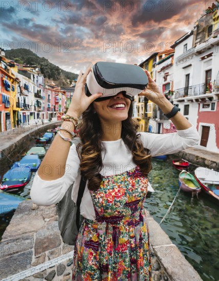 A woman wearing a colorful dress is holding a virtual reality headset. She is smiling and she is enjoying her experience. The scene takes place in a city with a canal running through it, AI generated