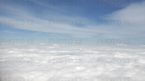 Aerial view on white fluffy clouds. View of the clouds from above, AI generated