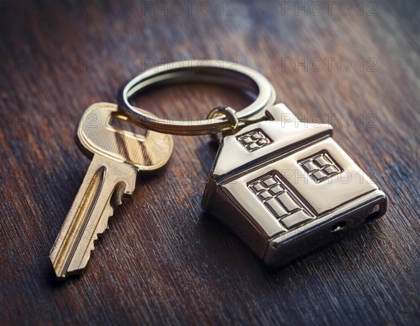 Property home and real estate insurance concept. Keychain of miniature model house. Mortgage concep, AI generated