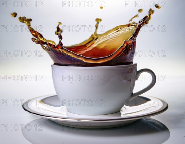 A visually dynamic splash of coffee leaping out of a sleek white cup, embodying energy and motion in a contemporary and artistic style, perfect for conceptual imagery or beverage-themed designs, AI generated
