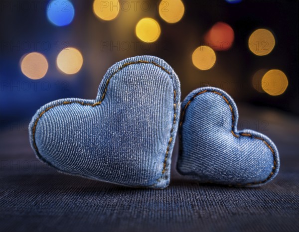 A beautiful heart-shaped denim pillow, symbolizing love and creativity, designed from repurposed blue denim. Showcasing intricate stitching and a distinctive design. Perfect for concepts of love, fashion, or upcycling handmade projects, AI generated