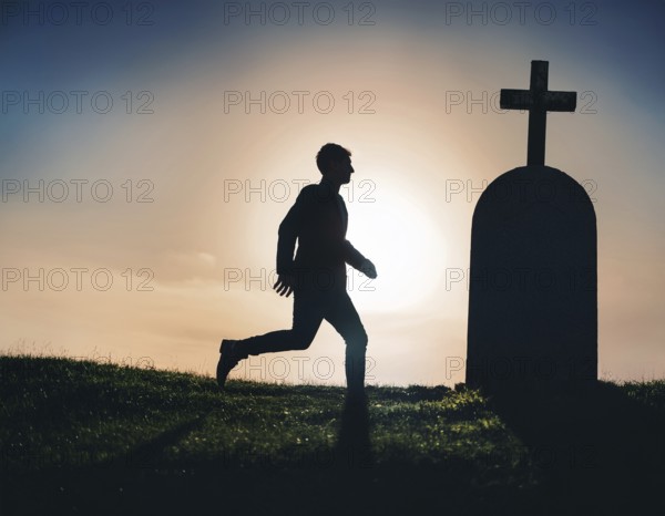 A silhouette of a lone figure walking off a gravestone, The scene evokes Resurrection thoughts emotional depth, AI generated