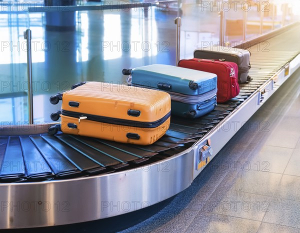 Baggage on a conveyor belt at an airport providing a travel and departure theme, AI generated