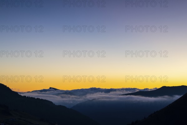 View from Furkajoch to Hoher Ifen, mountain range above sea of fog, dawn, dawn, autumn, Vorarlberg, Austria