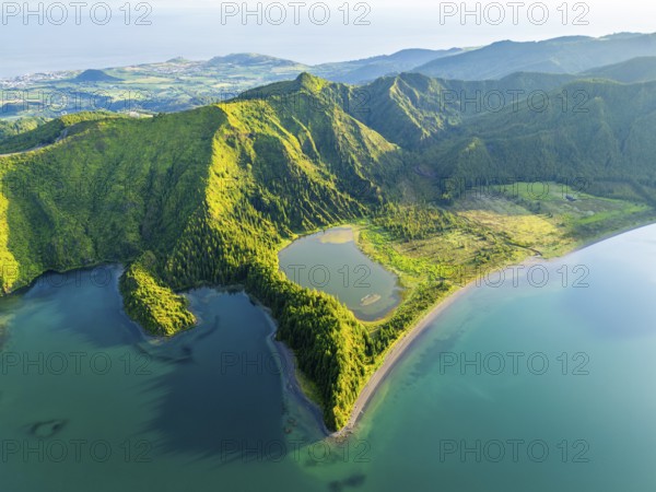 Lagoa do Fogo Lake on Sunny Morning. Green Lush Hills and Mountains. Azores, Sao Miguel Island. Portugal. Aerial Drone Shot