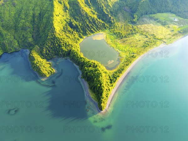 Lagoa do Fogo Lake at Sunrise. Green Lush Hills with Trees. Azores, Sao Miguel Island. Portugal. Aerial Overhead High Angle Shot