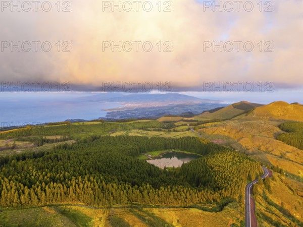Hills, Forest and Lagoon Canario at Sunset. Atlantic Ocean. Azores, Sao Miguel Island, Portugal. Aerial View