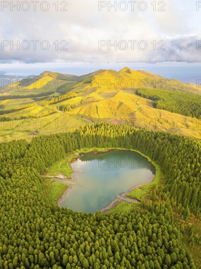 Hills, Forest and Lake Lagoa do Canario at Sunset. Azores, Sao Miguel Island, Portugal. Aerial View