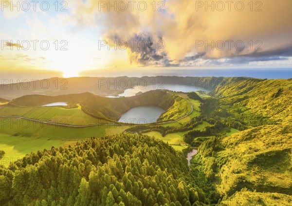 Panorama of Sete Cidades Caldera at Sunset. Blue Lake, Lake Rasa and Santiago Lake. Forest and Hills with Pasturelands. Azores, Sao Miguel Island. Portugal. Aerial Panoramic Shot
