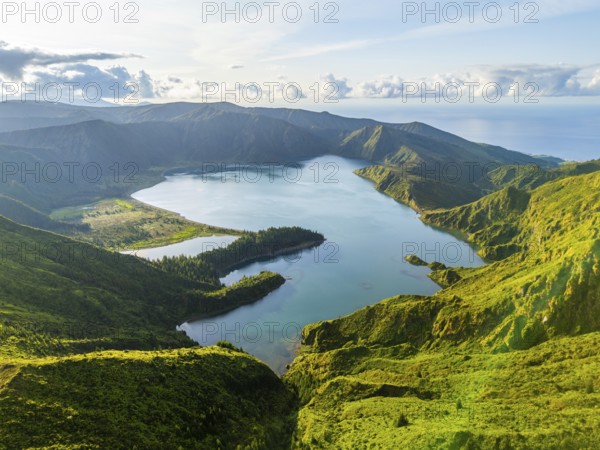 Lagoa do Fogo Crater Lake at Sunrise. Green Lush Hills and Mountains. Azores, Sao Miguel Island. Portugal. Aerial Drone Shot