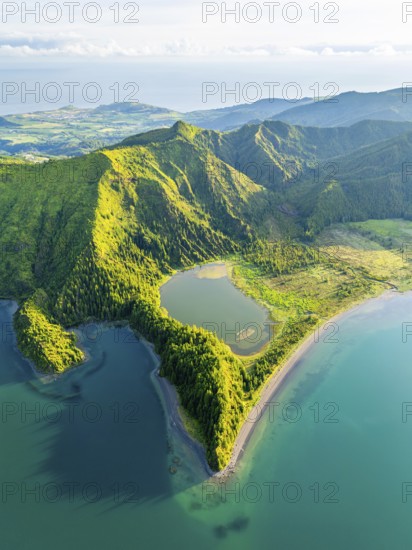 Lagoa do Fogo Lake on Sunny Morning. Green Lush Hills and Mountains. Azores, Sao Miguel Island. Portugal. Aerial Drone Shot