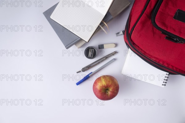 Backpack books notepad pen ruler. School supplies