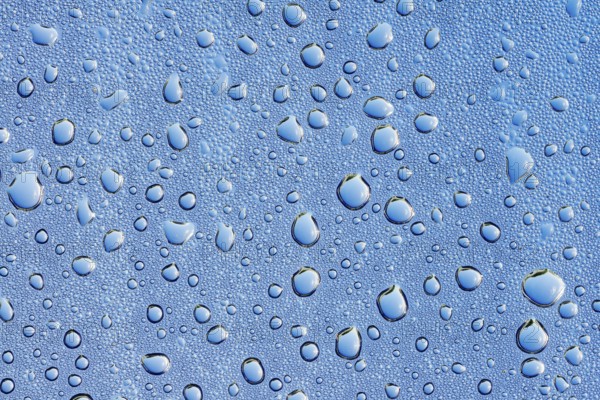 Drops of water on a blue surface, North Rhine-Westphalia, Germany