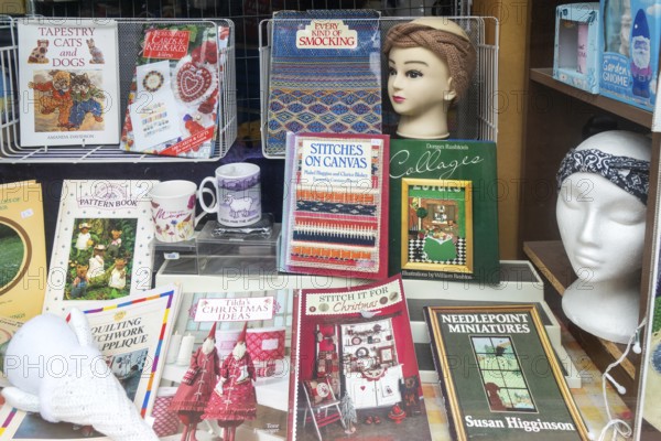 Shop window display books materials for stitching and smocking, Make Do And Mend shop, The Brittox, Devizes, Wiltshire, England, UK