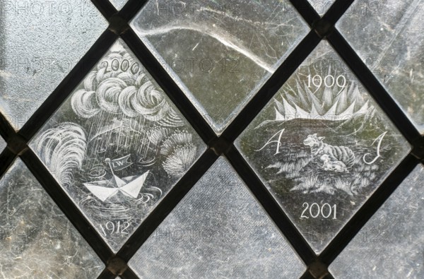 Glass engraved memorial panes, St Mary's church, Alton Barnes, Wiltshire, England, UK designed by Laurence and Simon Whistler