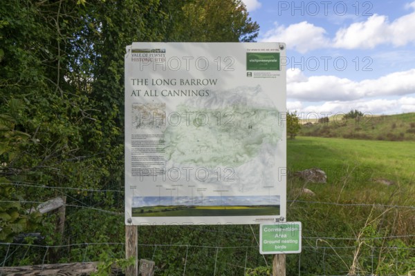 Information notice sign, Modern-day neolithic style long Barrow burial chamber for storing cremation urns, All Cannings, near Devizes, Wiltshire, UK built 2014