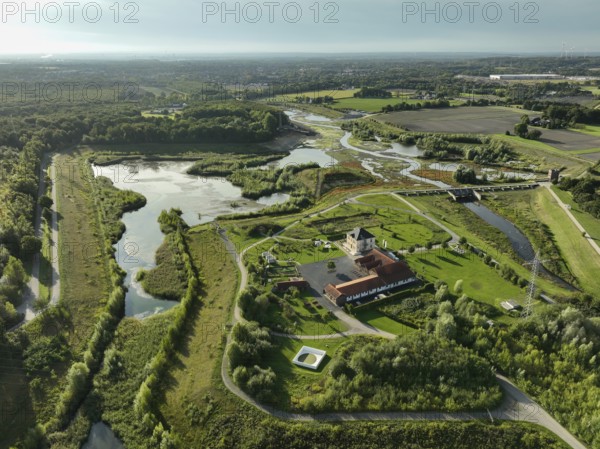 Dortmund, Castrop-Rauxel, North Rhine-Westphalia, Germany - River renaturalisation, renaturation of the Emscher, flood retention basin HRB Mengede. A new floodplain landscape is being created at the Emscher-Auen farm, expanding the area for flood protection during heavy rainfall and for biodiversity. The previously straightened Emscher is being given curves again and can meander through its new floodplain. Following the construction of a parallel sewer, the Emscher has been completely free of sewage since 2022. The river was previously an open, above-ground combined sewer with rainwater and wastewater