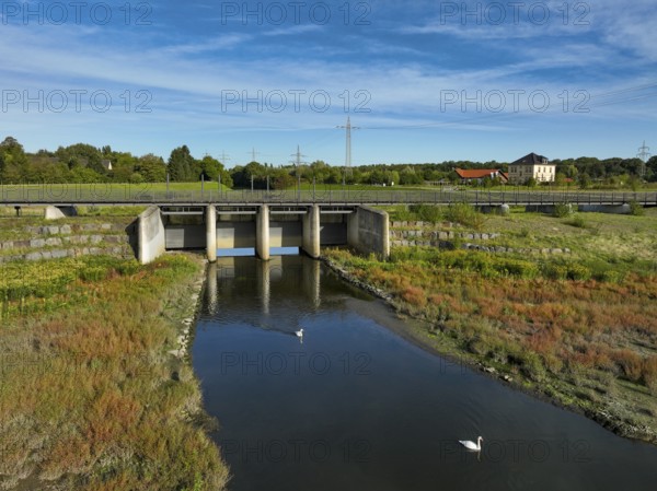 Dortmund, Castrop-Rauxel, North Rhine-Westphalia, Germany - River renaturalisation, renaturation of the Emscher, flood retention basin HRB Mengede. A new floodplain landscape is being created at the Emscher-Auen farm, expanding the area for flood protection during heavy rainfall and for biodiversity. The previously straightened Emscher is being given curves again and can meander through its new floodplain. Following the construction of a parallel sewer, the Emscher has been completely free of sewage since 2022. The river was previously an open, above-ground combined sewer with rainwater and wastewater