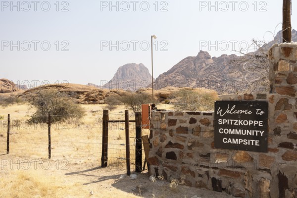 Entrance to the Spitzkoppe Community Campsite, Namibia - 1 Setembro, 2025: with a scenic view of the iconic granite peaks and surrounding arid landscape