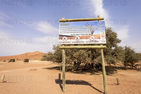 The Deadvlei sign, Namibia - 27 August, 2025: explains the history of the clay pan, how its ancient camelthorn trees died, and the formation of the surrounding red dunes over centuries