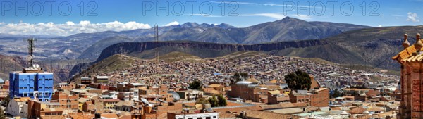 Far-reaching panorama with cityscape and surrounding mountains under a clear sky, view over the city of Potosi in Bolivia