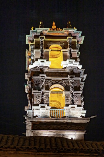 Illuminated church tower with intricate architectural details at night, The churches of the city of Potosi in Bolivia
