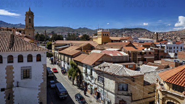 Central square of the city with church towers and mountains in the background, The streets of the historic centre of Potosi in Bolivia