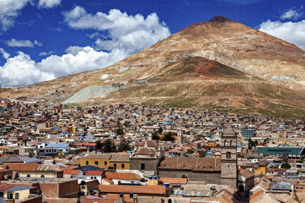 Versatile city with red roofs and a striking mountain in the background, the Cerro Rico silver mountain in Potosi, Bolivia
