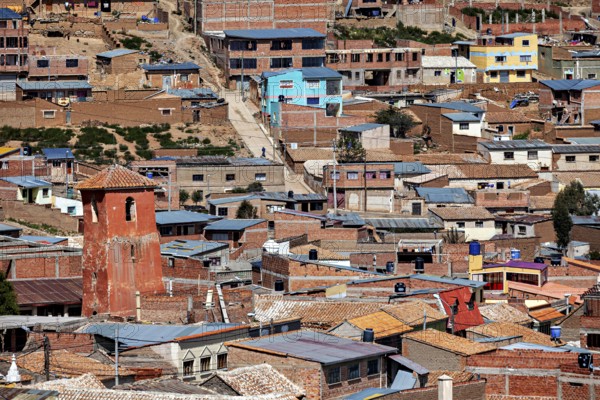 Urban area with orange-coloured roofs in a slightly hilly environment with pastel shades, view over the city of Potosi in Bolivia